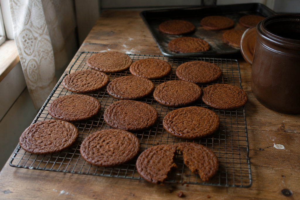 old-fashioned molasses cookies cooling on a wire rack.